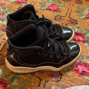 Nike Kids Jordan’s Black and White High-Top Sneakers